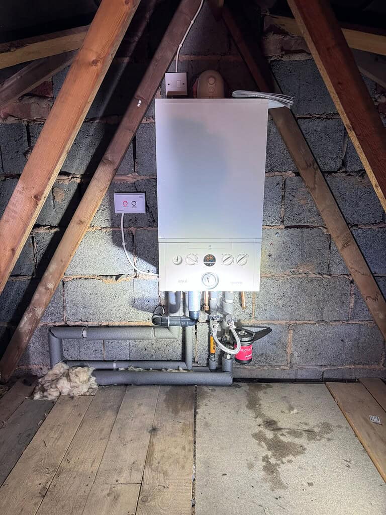 Modern boiler installation in an attic space by RML Plumbing & Heating Derby.